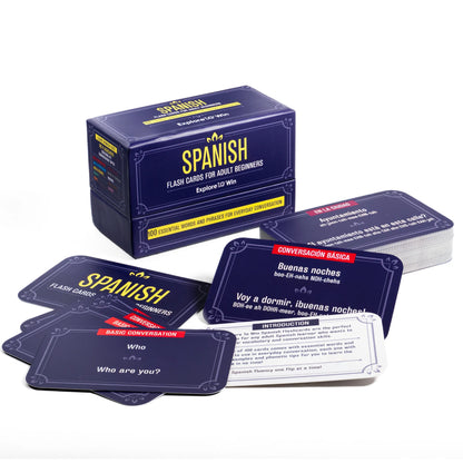 Spanish flashcards laid out in front of the box 